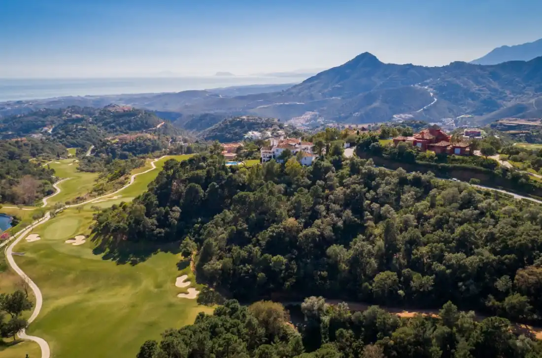 Aerial view of La Zagaleta showing villas, golf course, forest and the Mediterranean Sea near Marbella
